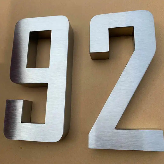 silver metal house numbers