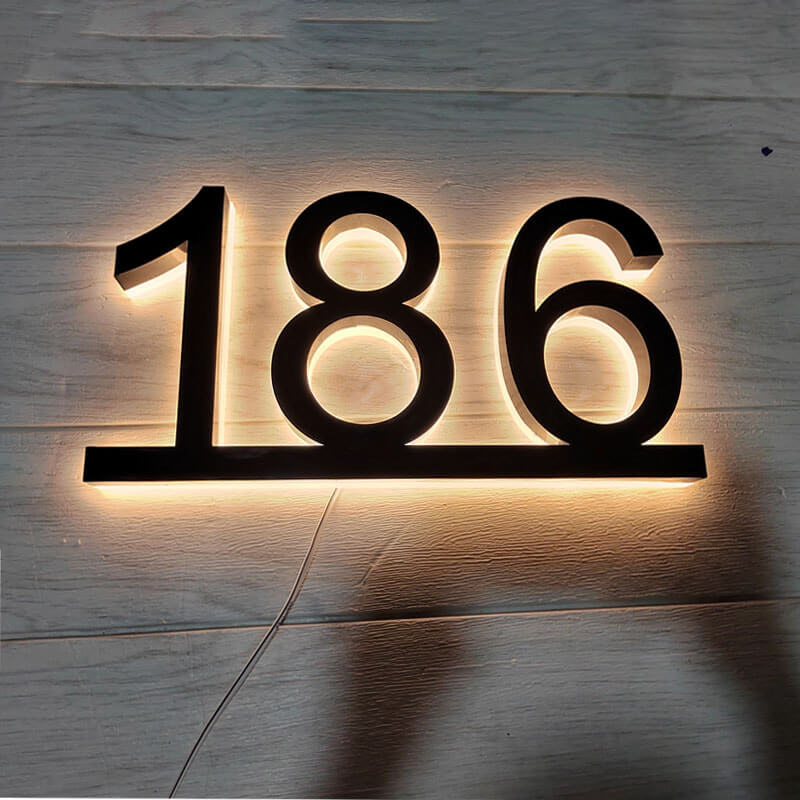 Backlit house numbers with optional decorative brackets