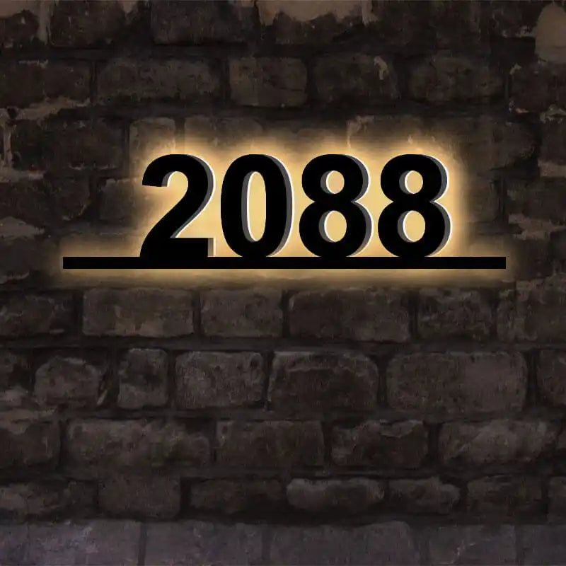Matte black backlit address plaque with modern sans-serif font
