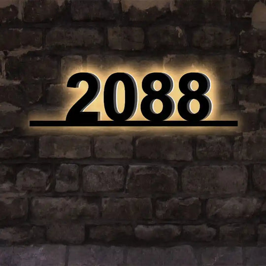 Matte black backlit address plaque with modern sans-serif font