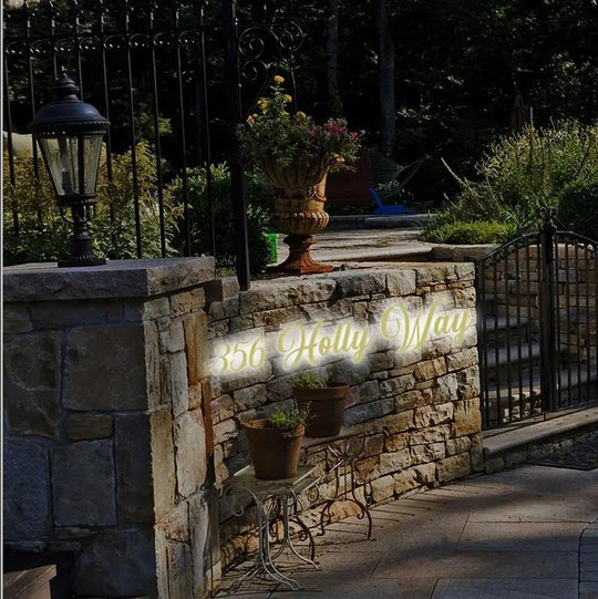 Modern black house numbers with built-in LED lighting for visibility